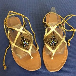 Report Metallic Gold Tie Leg Lace Up Straps Flat Sandals Tribal African beading